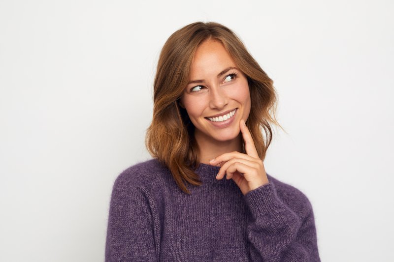 Patient smiling after cosmetic dentistry